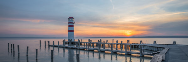 panoramic-canvas-print-lighthouse-in-the-sunset-panorama